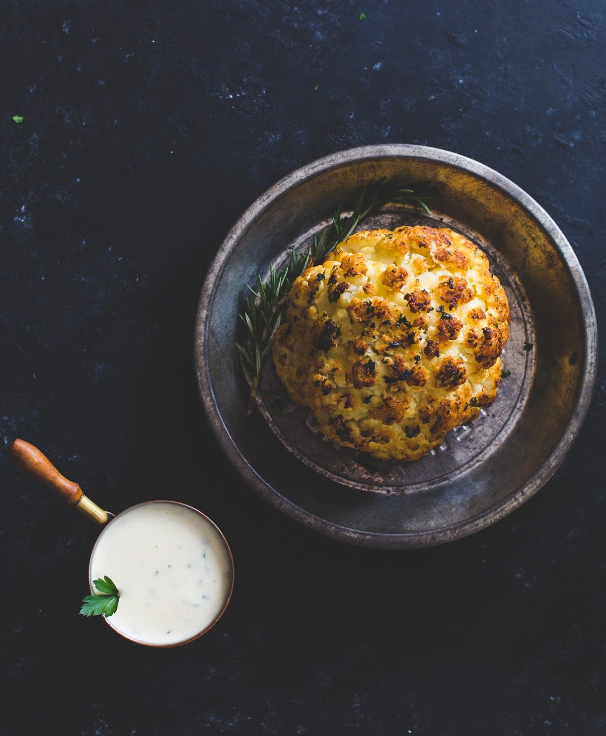 Incredible Whole Roasted Cauliflower with Cheese Sauce
