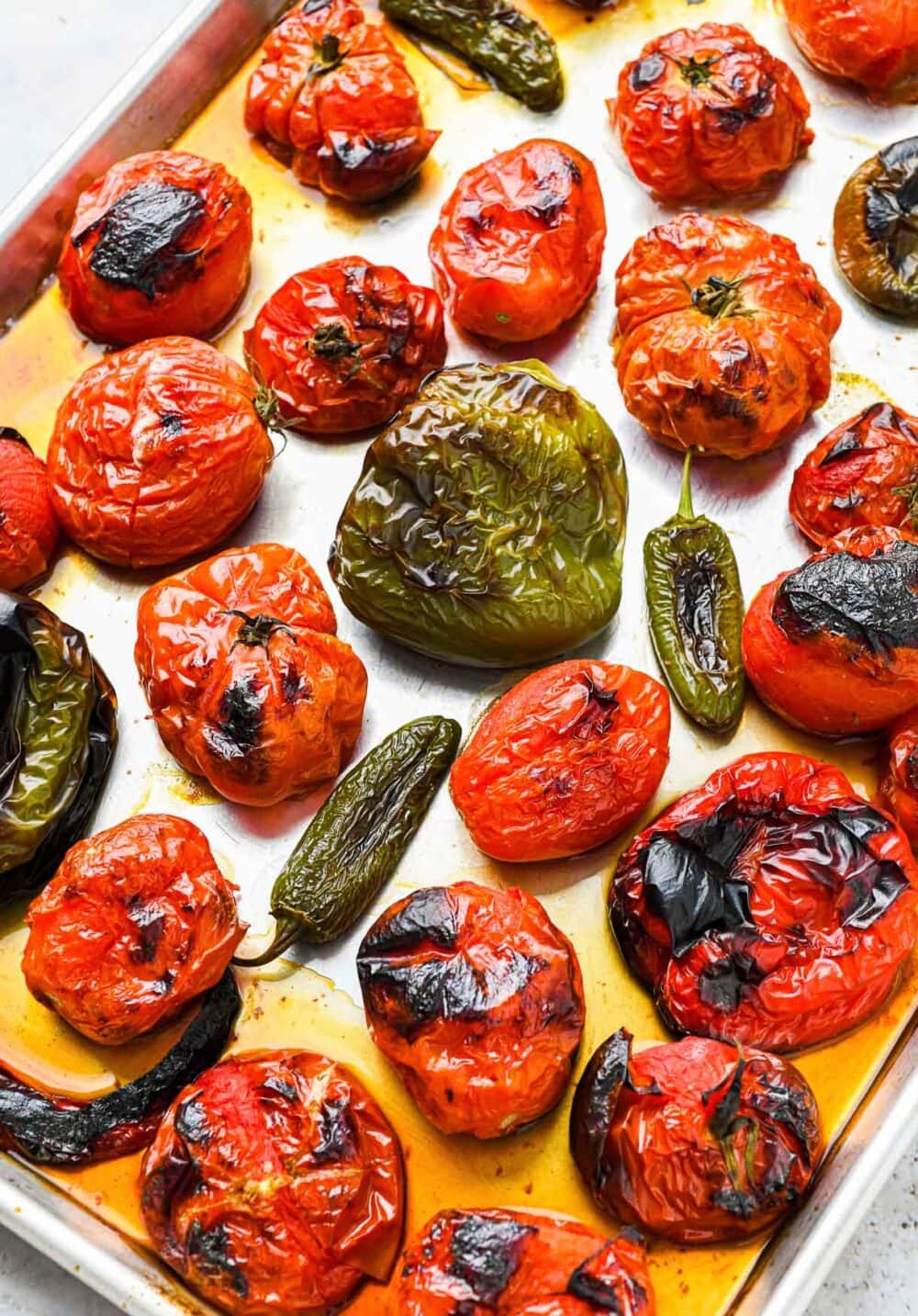 tomatoe, jalapenos, peppers, broiled on a sheet pan