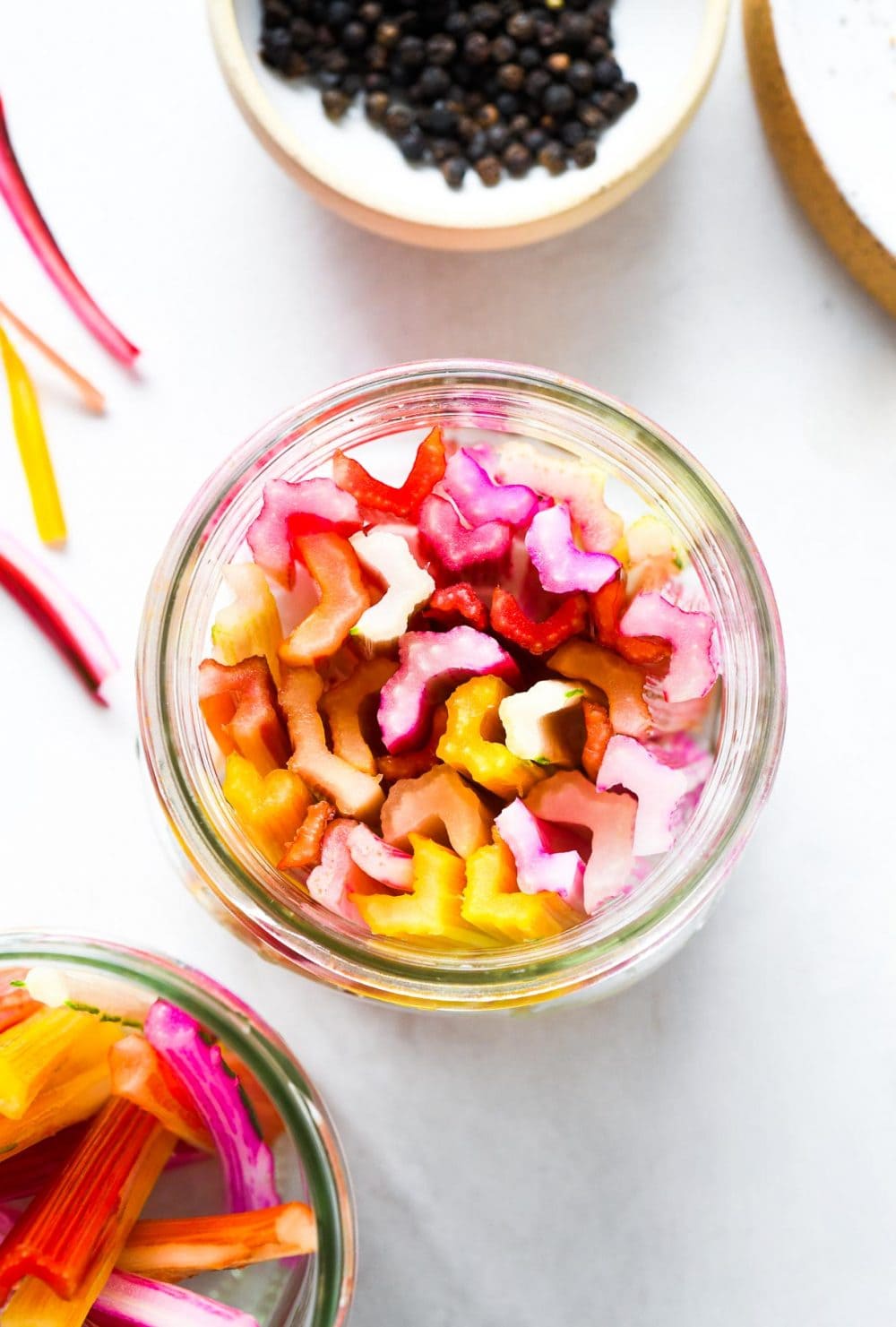 swiss chard stems in a mason jar, top down view.