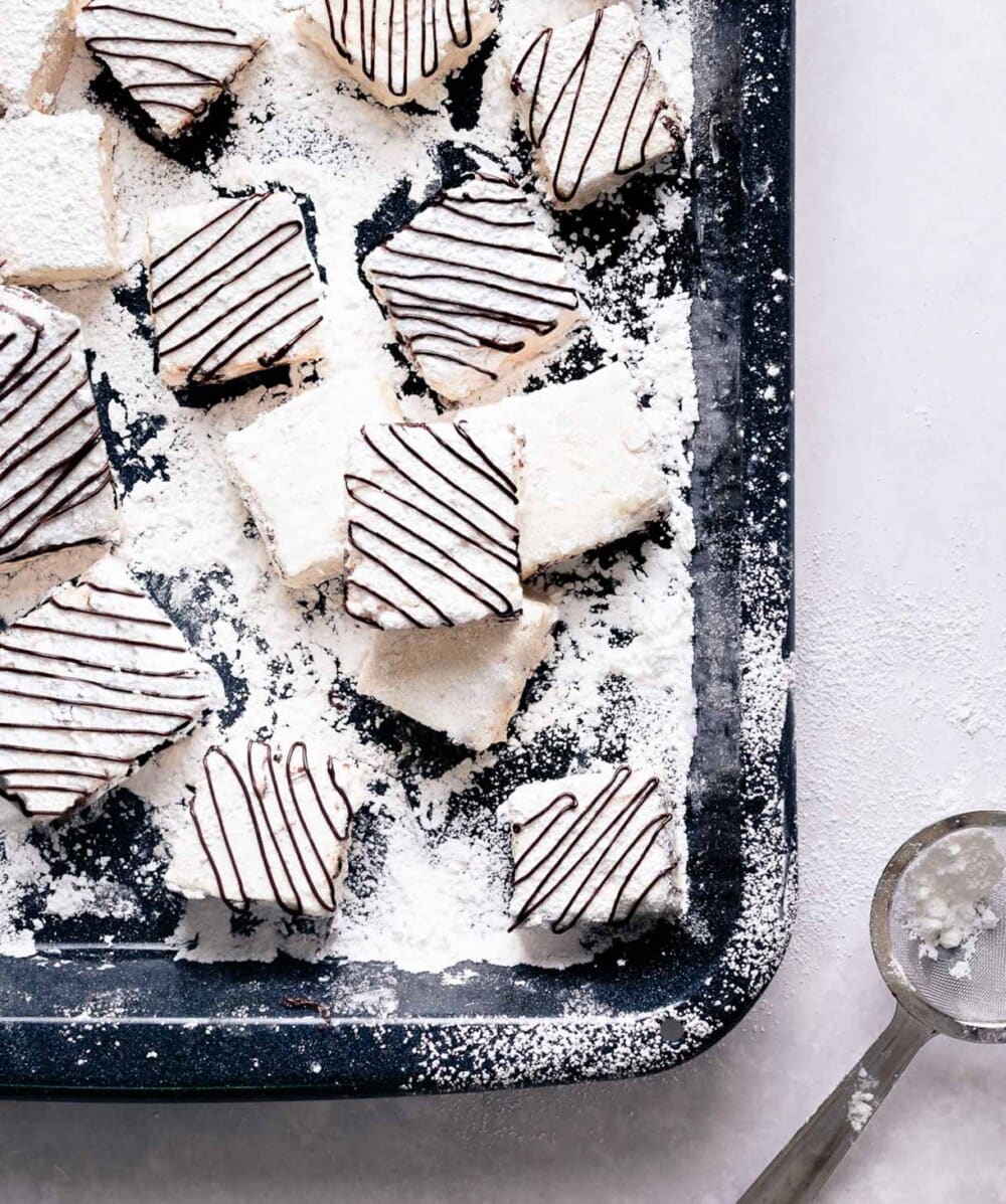 homemade espresso marshmallows in a black tin