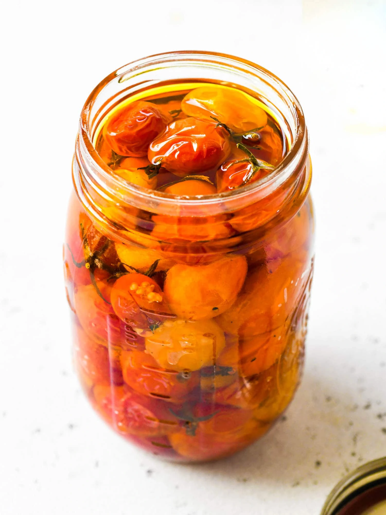 slow roasted tomatoes preserved in olive oil in a jar