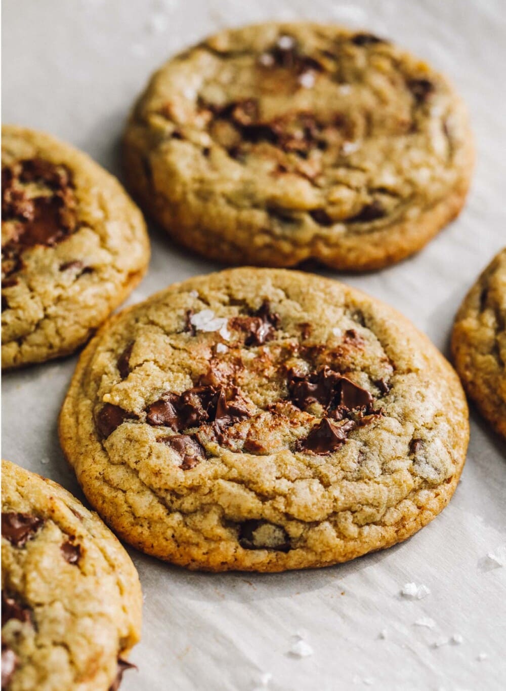 chewy gluten-free chocolate chip cookies on parchment paper