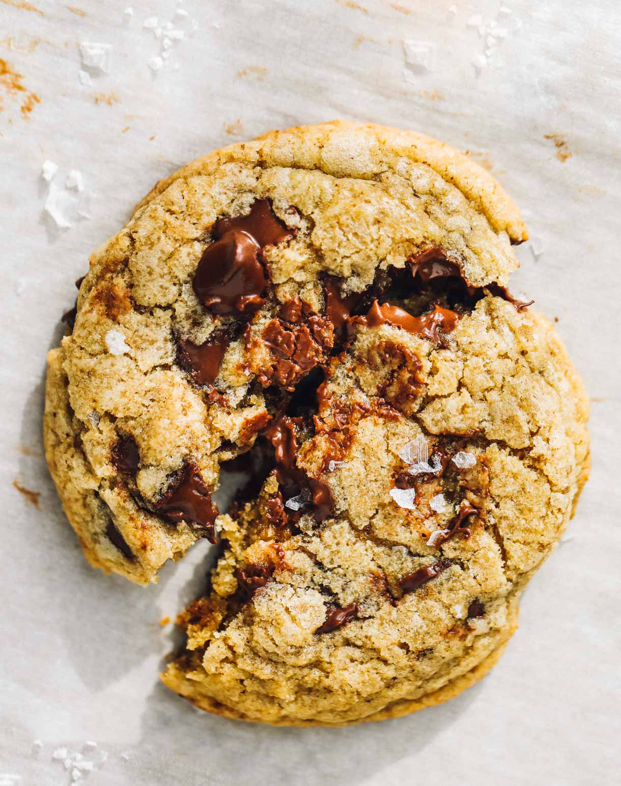 gooey chocolate chip cookie on parchment paper