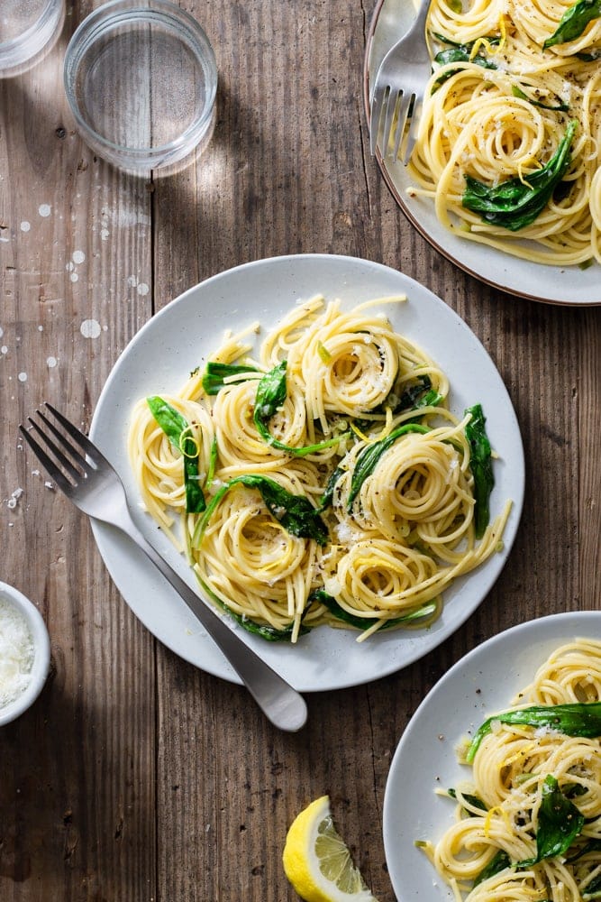 spaghetti with ramps on white plate, with silver fork