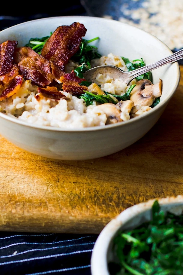 Savory Oatmeal with Garlicky Greens & Bacon {recipe}