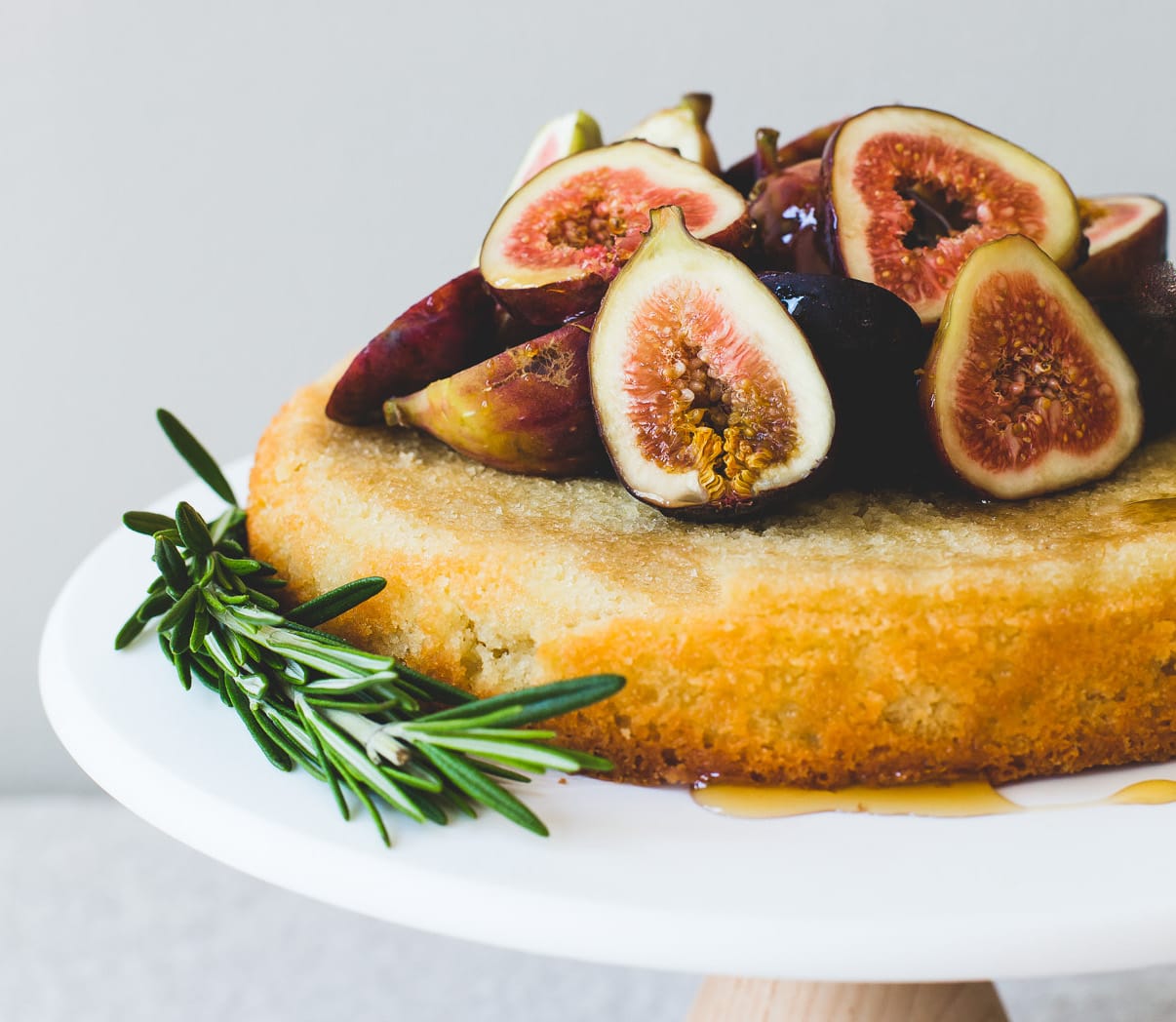 almond flour cake with fresh figs on a cake stand