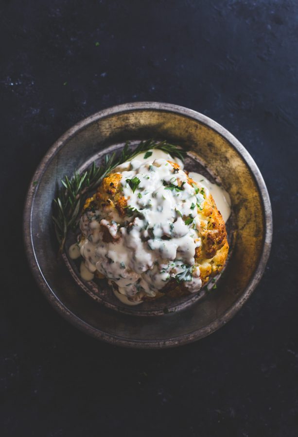 Incredible Whole Roasted Cauliflower Recipe with Cheese Sauce