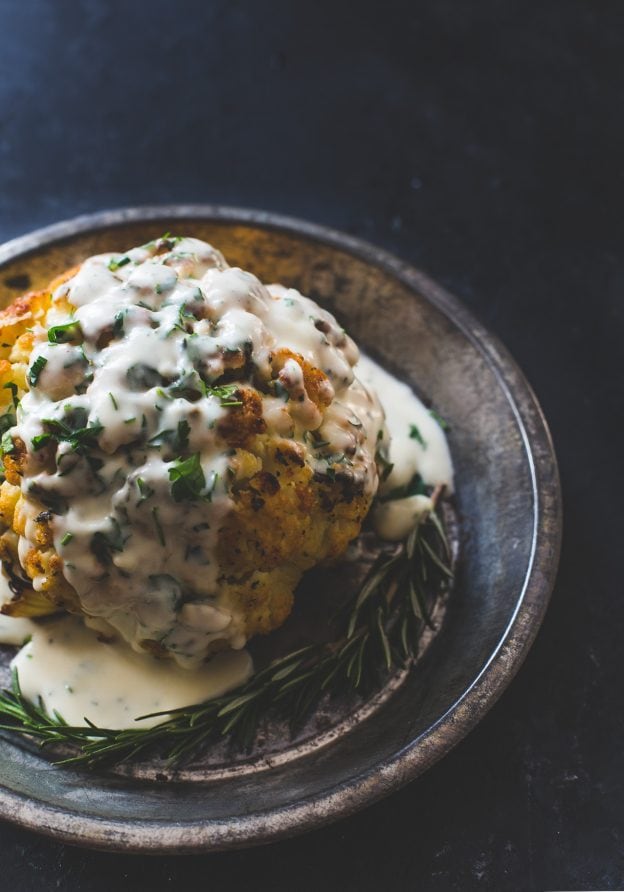 Incredible Whole Roasted Cauliflower Recipe with Cheese Sauce