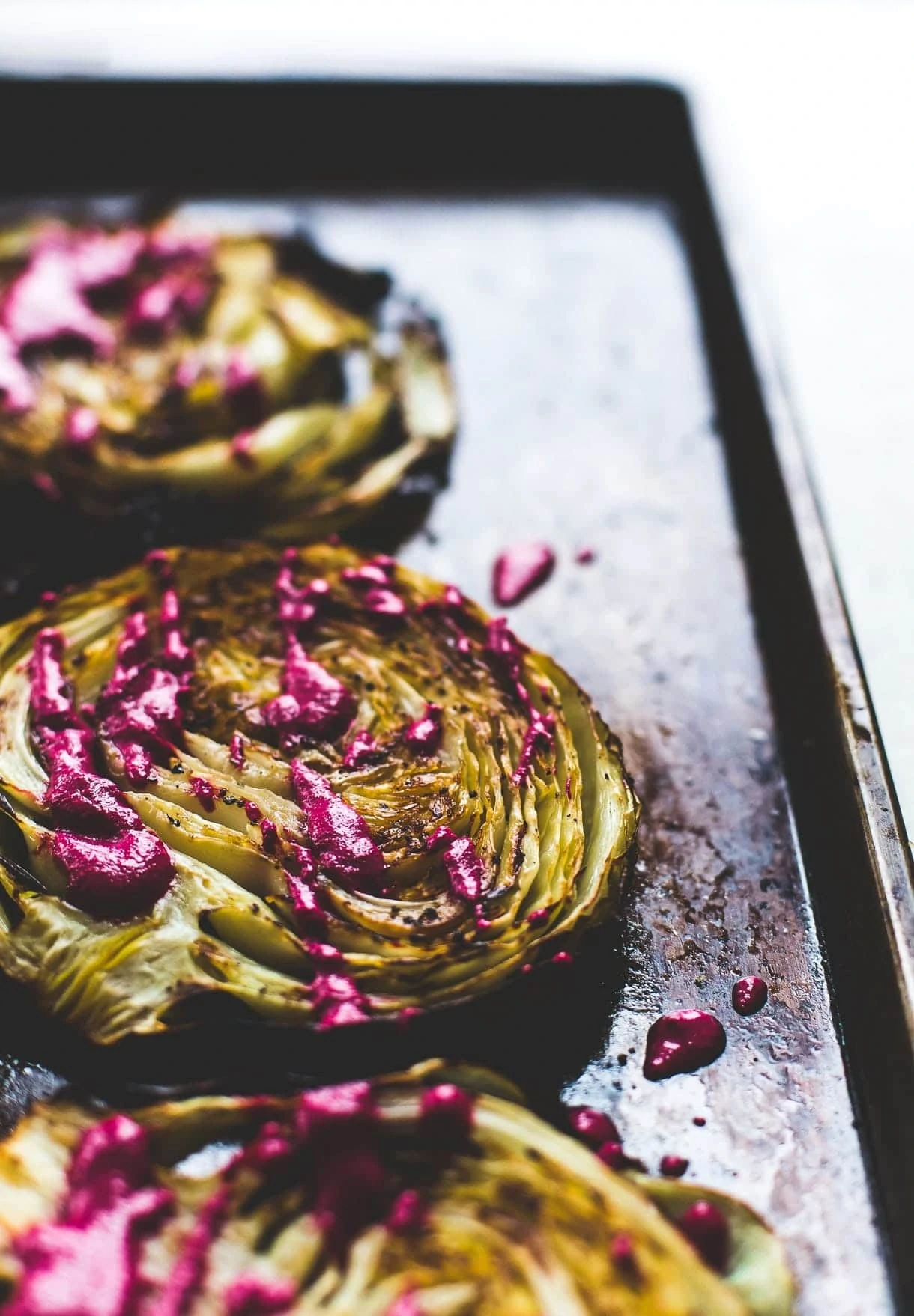 Roasted Cabbage Steaks with Garlicky Beet Sauce / roasted cabbage wedges / vegetarian recipe