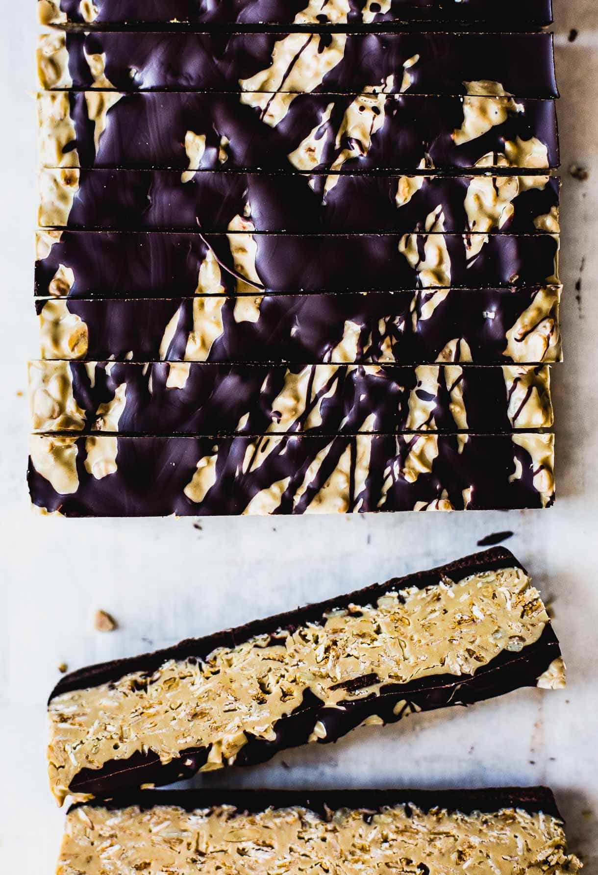 Seedy White Chocolate Granola Slices -- like a homemade granola candy bar, drizzled in dark chocolate