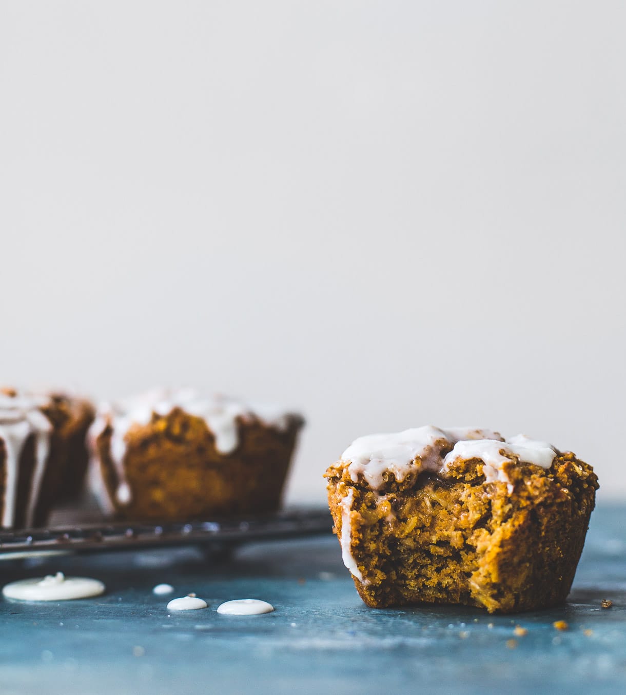 Deliciously Healthy Sweet Potato Muffins with Vanilla Icing -- vegan and gluten free, no bananas, made with teff flour