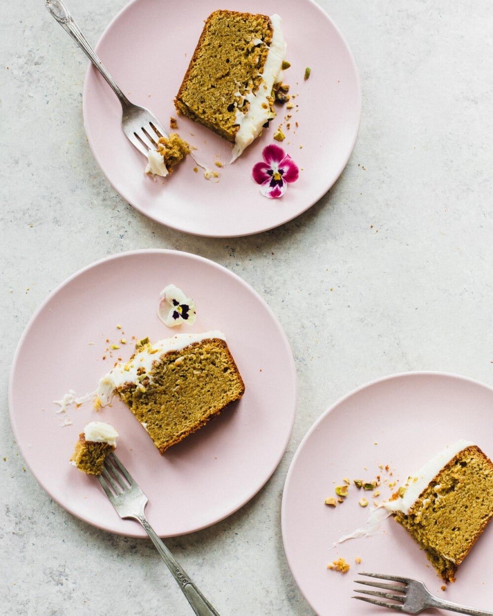 gluten-free pistachio cake on pink plates