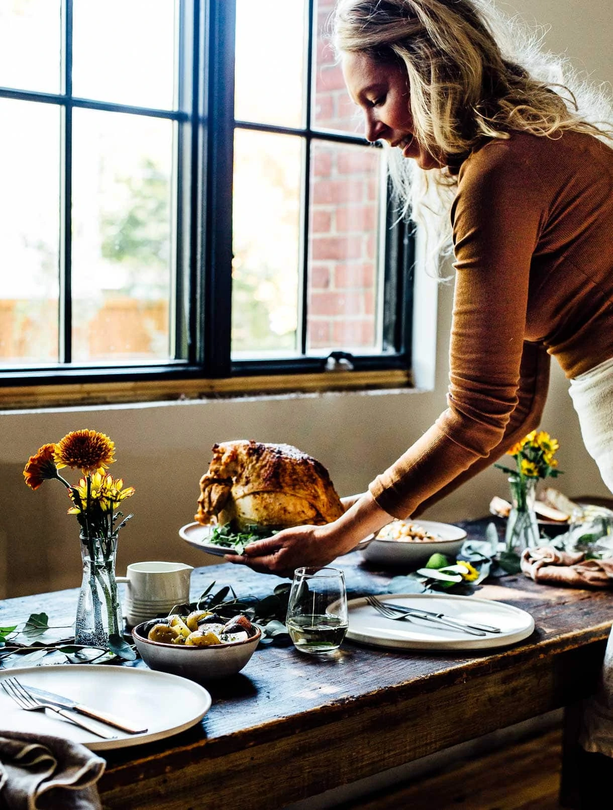 setting the friendsgiving table, serving turkey