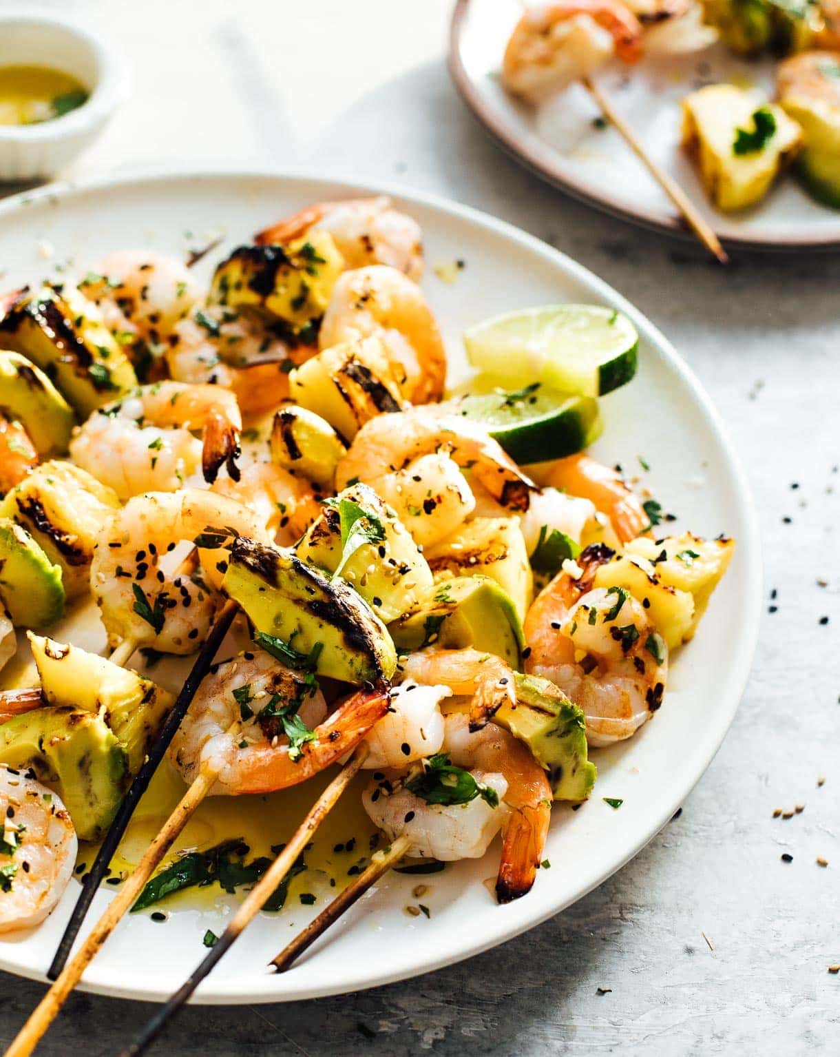 grilled shrimp kabobs with pineapple and avocado served with beer