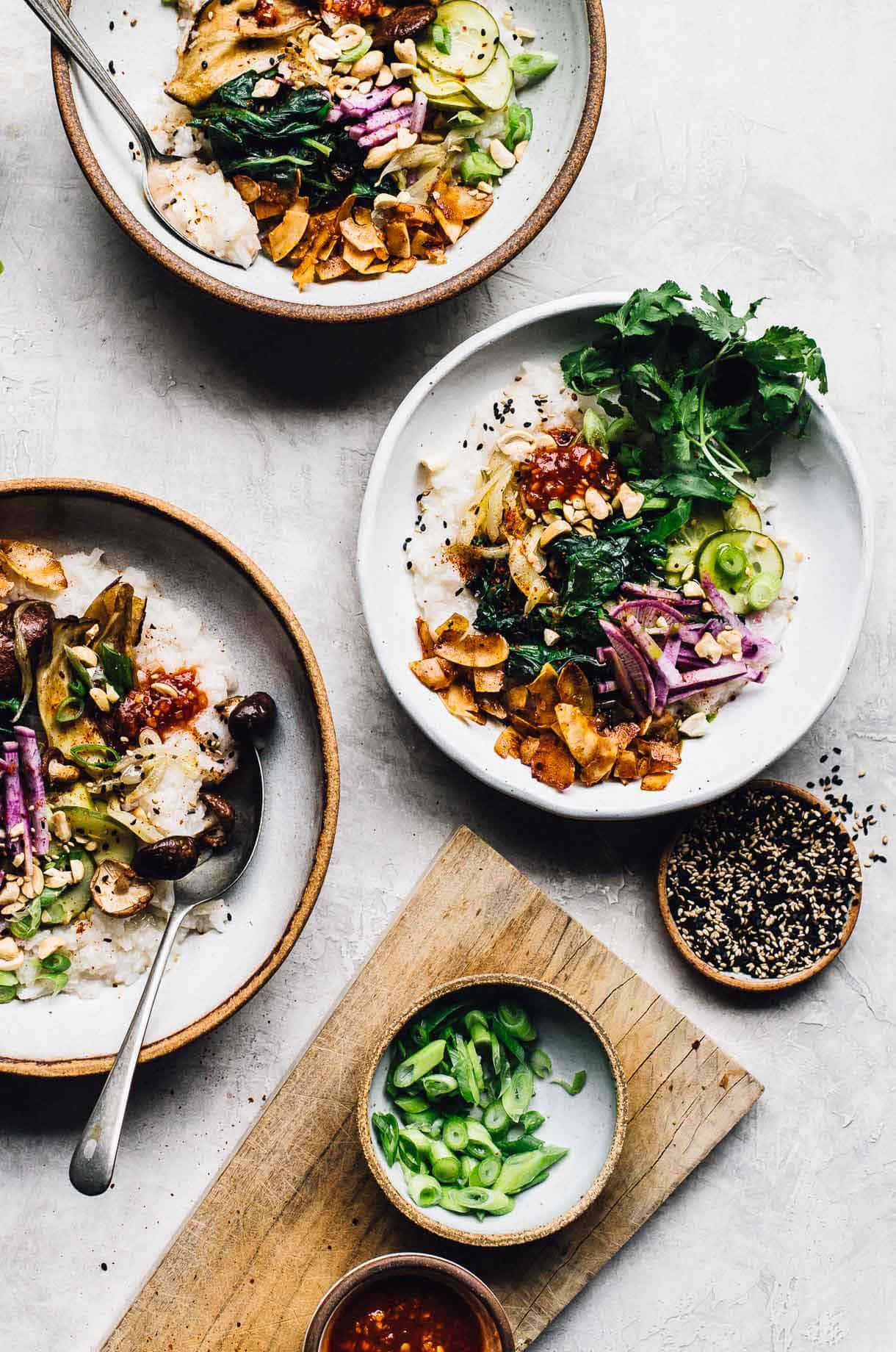 three bowls of vegetarian congee made in the instant pot