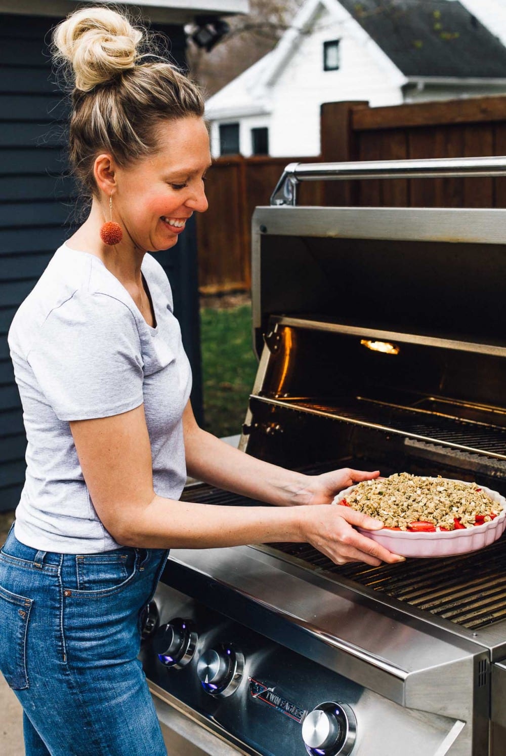 putting rhubarb crisp onto the grill