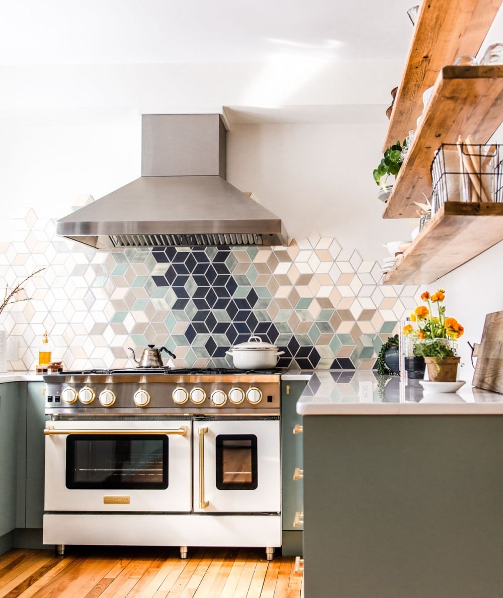 white kitchen with white blue star range and stainless steel hood