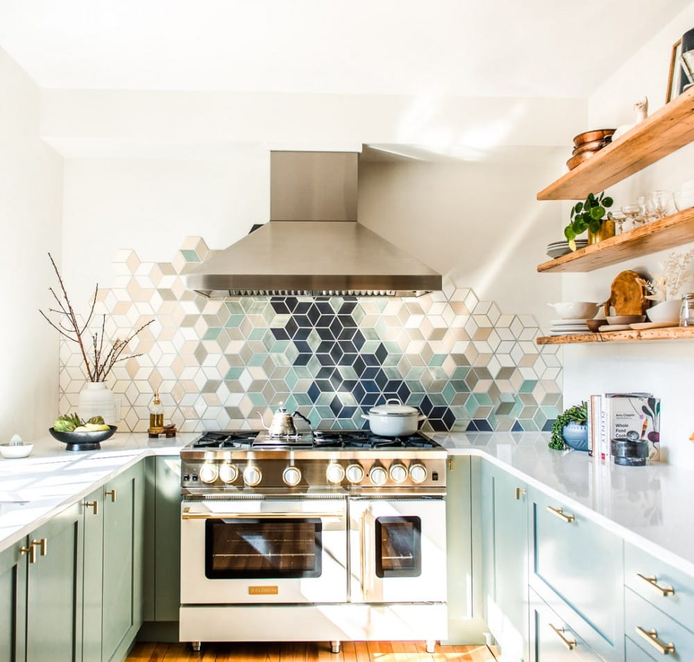 white kitchen with white blue star range and stainless steel hood