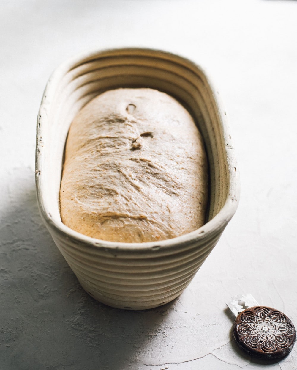 rye sourdough rising in a banneton