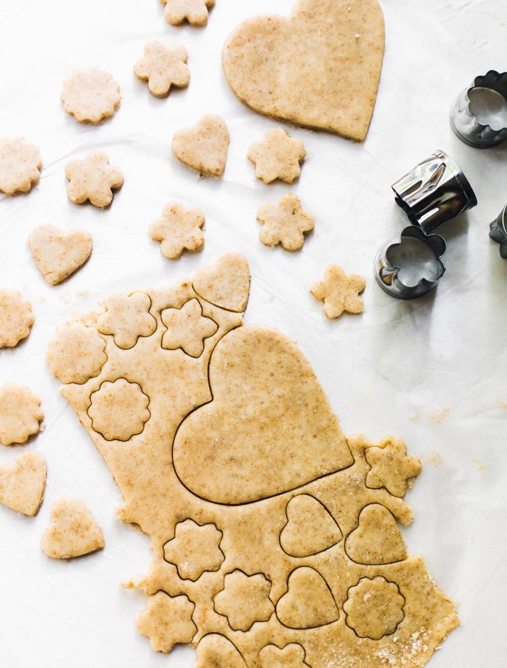 cutting out hearts out of pie crust dough with mini cookie cutters