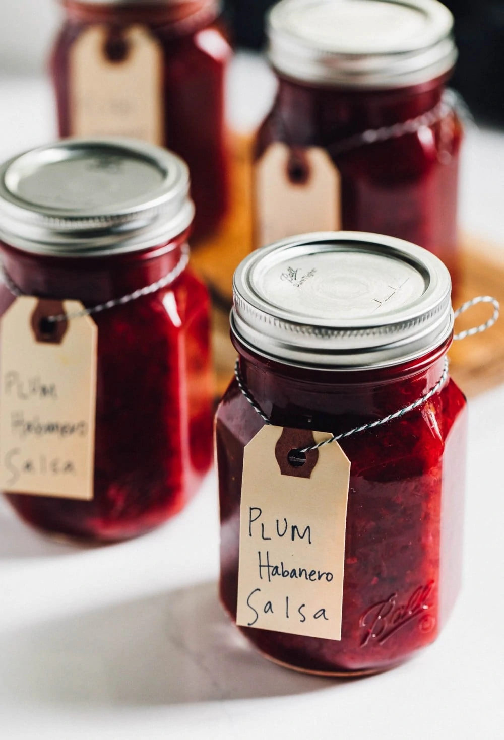 plum habanero salsa in glass ball jars, lined up