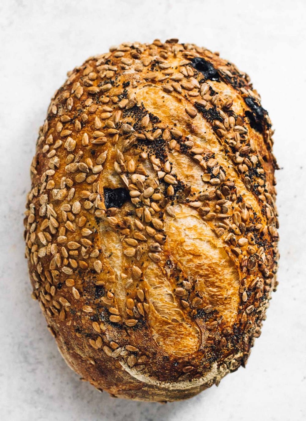 Sourdough Bread with a sunflower seed and poppy seed crust, overhead photo