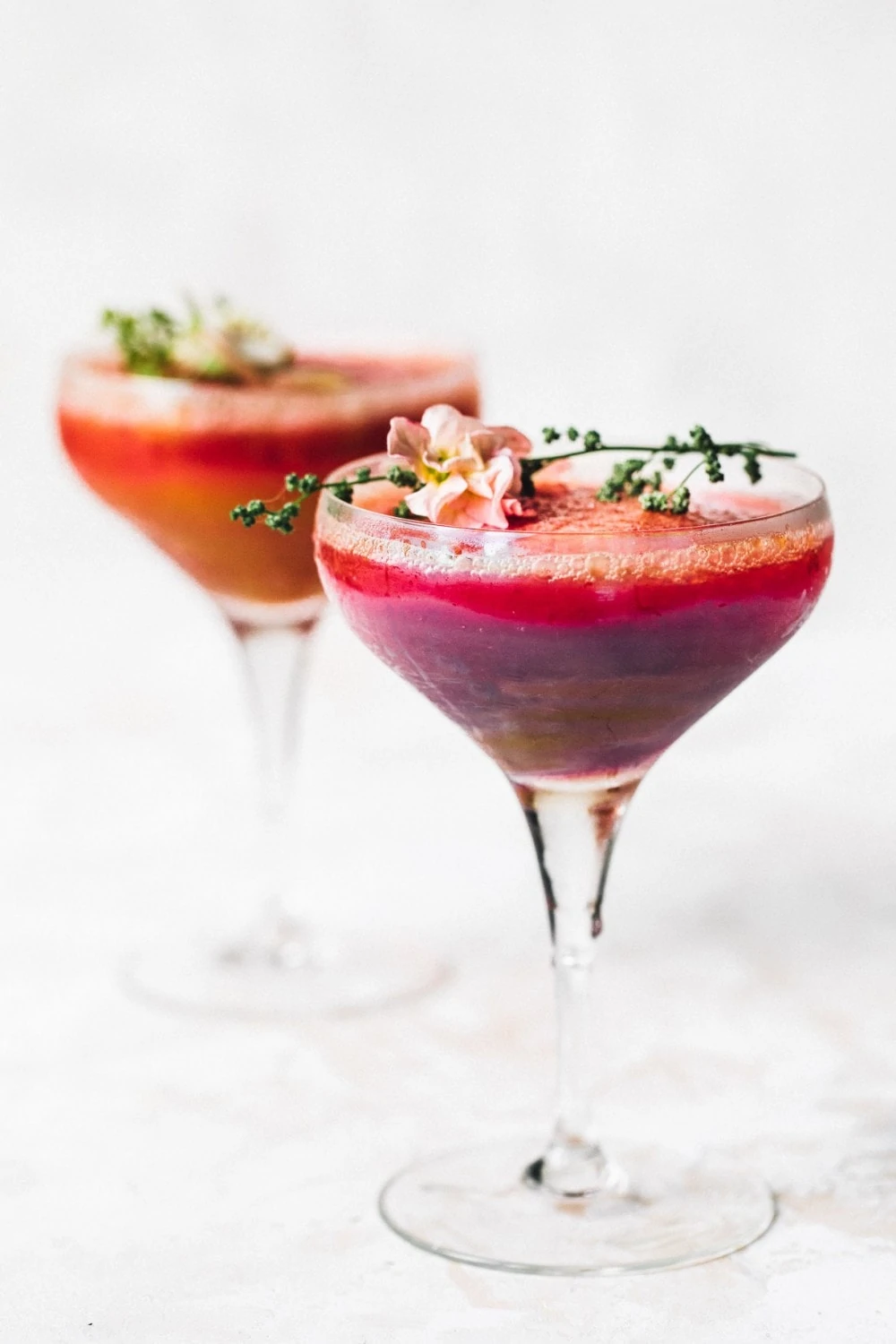 two frozen wine cocktails in fancy glasses