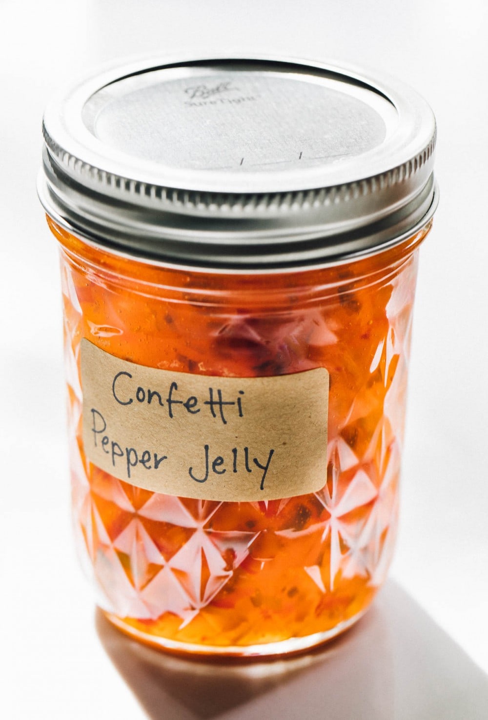 confetti pepper jelly in a clear canning jar
