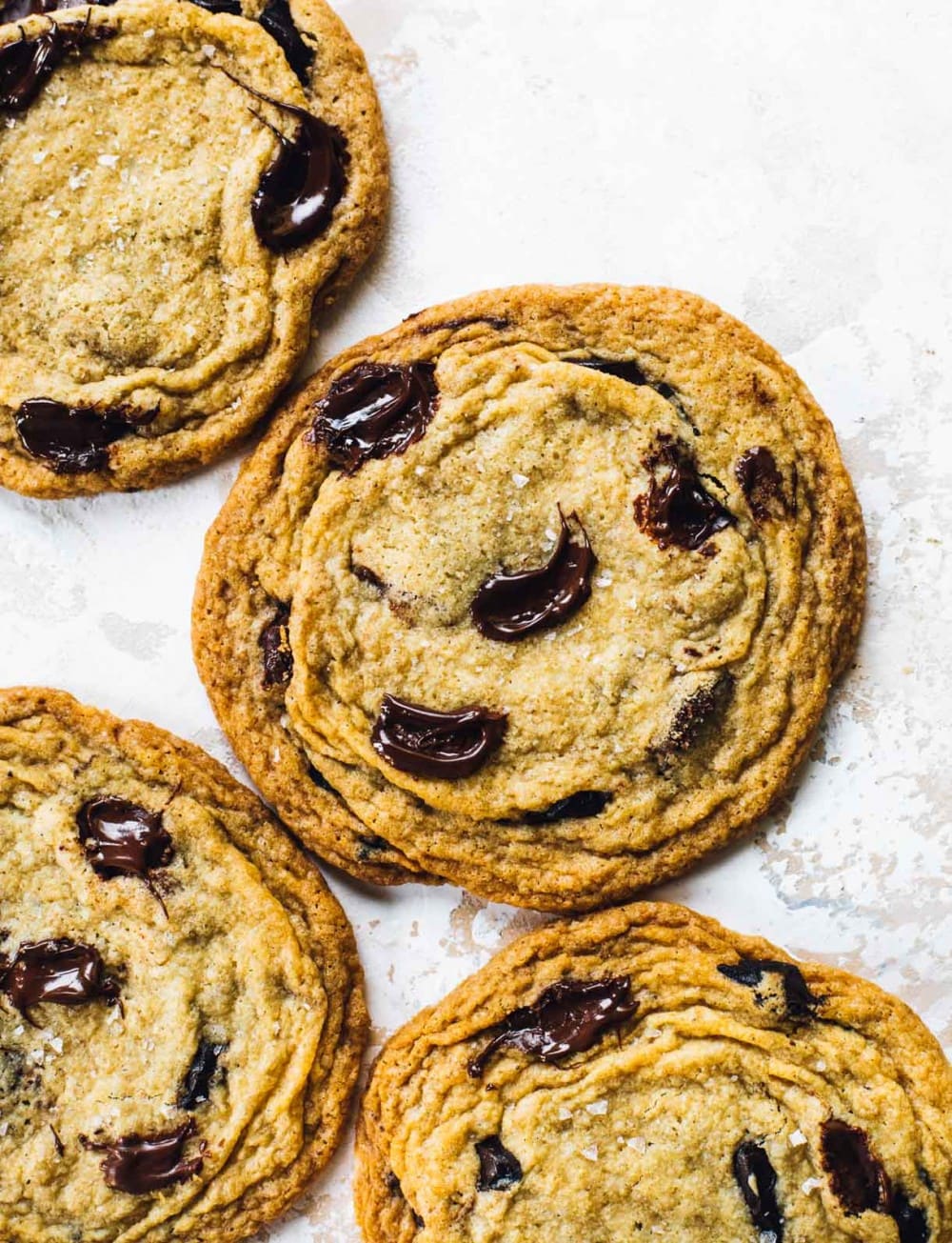 giant chocolate chip cookies on a board