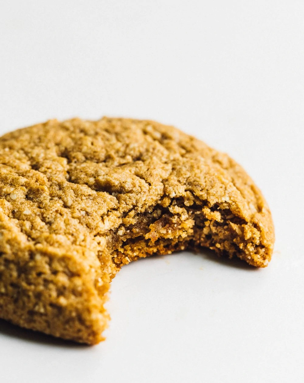 gluten free pumpkin cookie with a bite taken out of it. 
