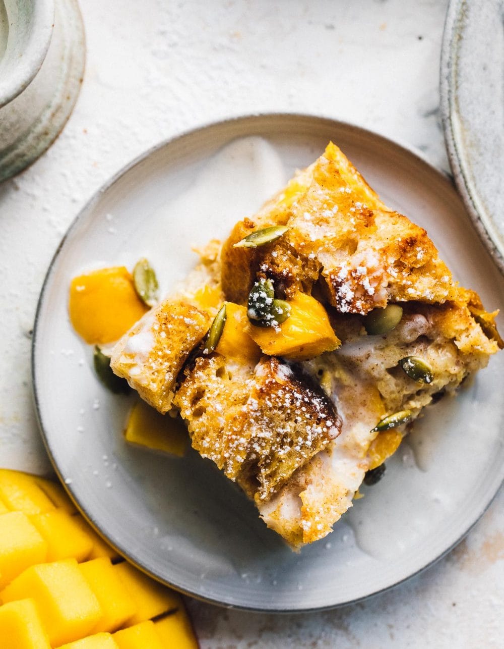 mango bread pudding on a plate