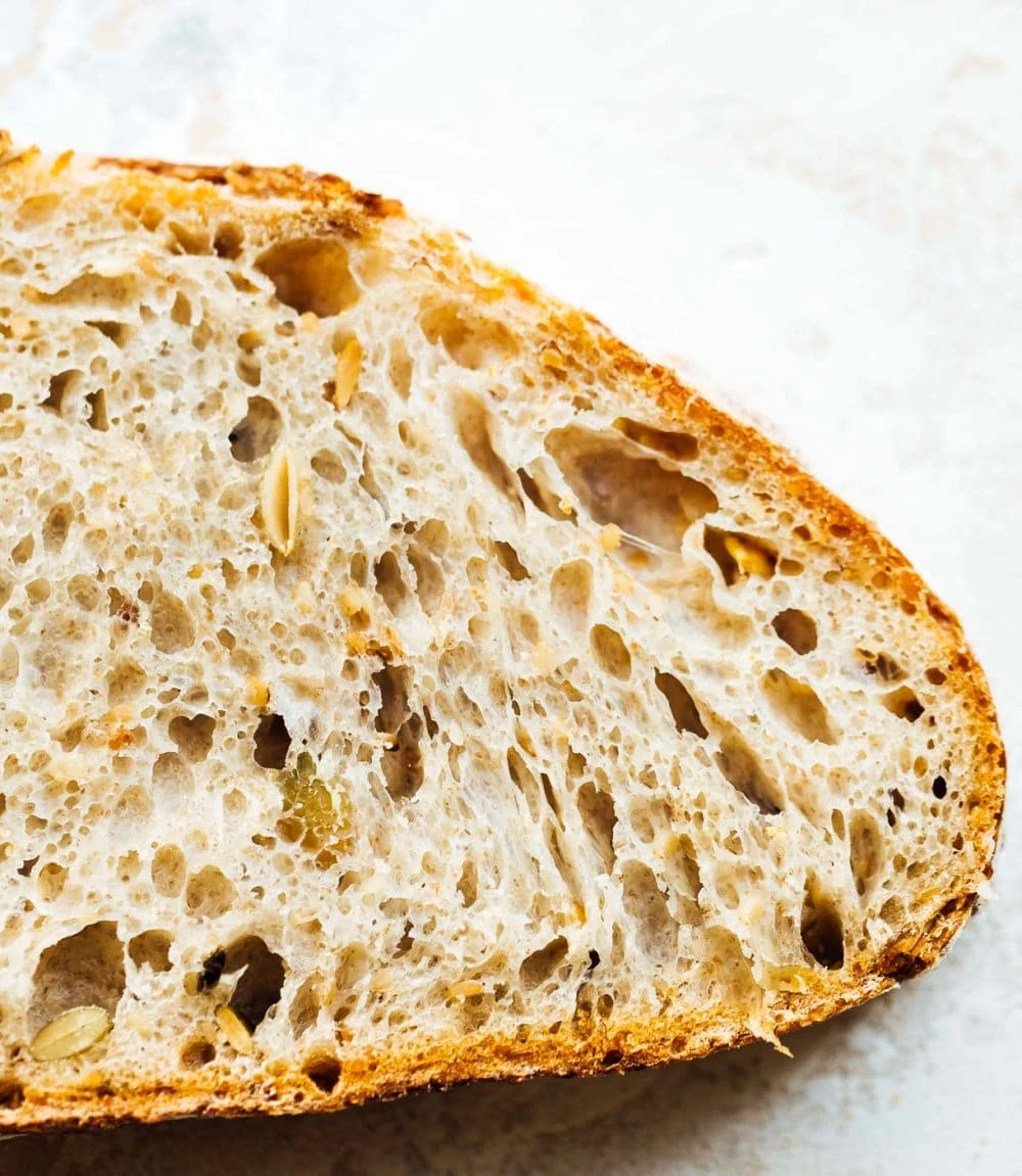 seeded sourdough bread, up close image