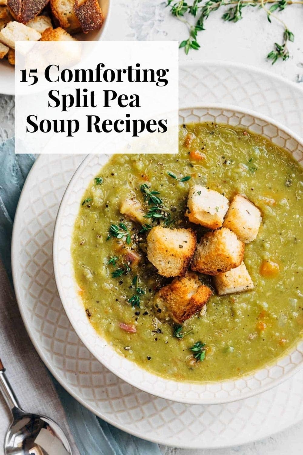 a bowl of split pea soup with croutons on top. soup is in white bowl, set on a white plate.