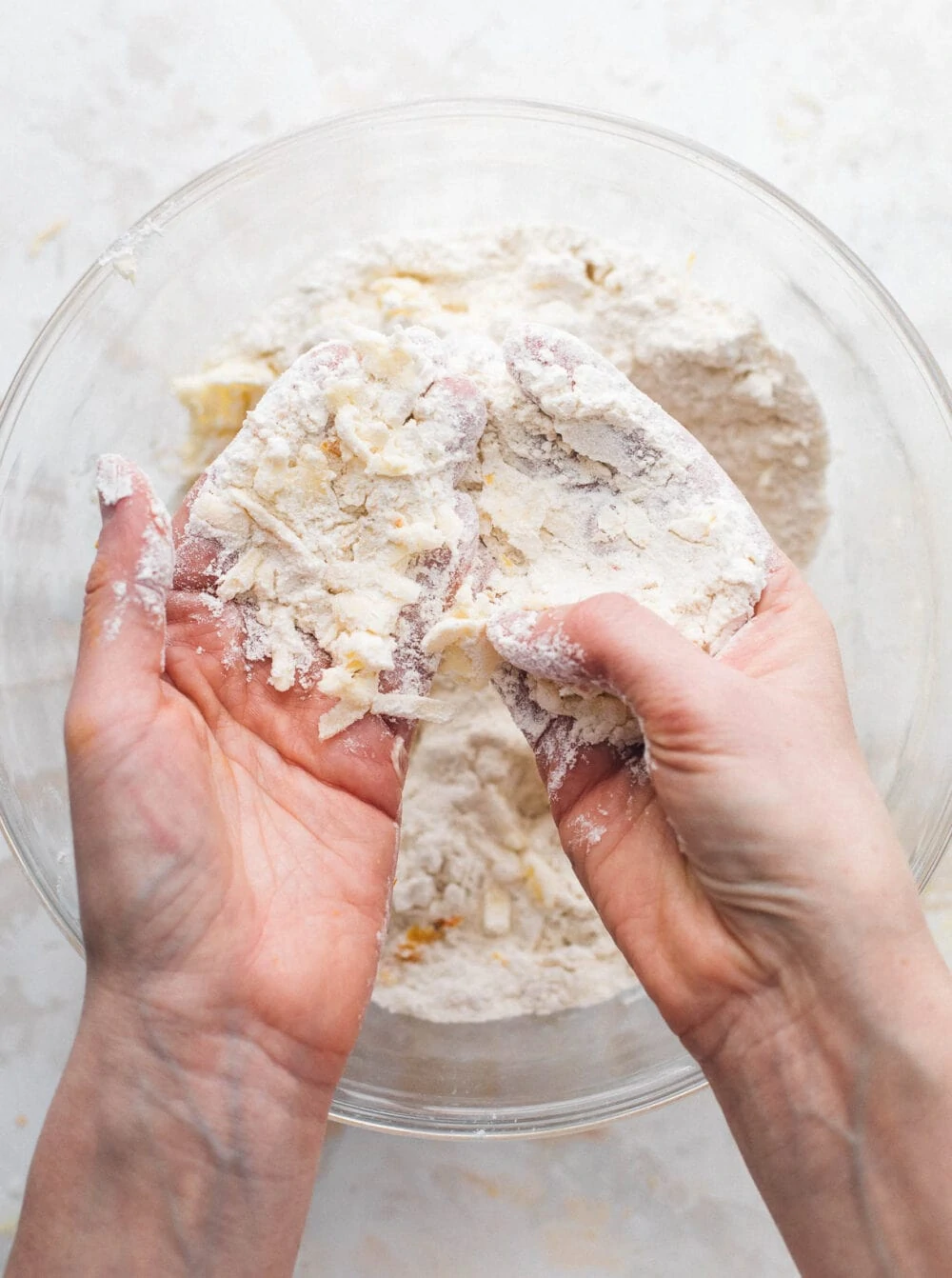 rubbing flour in between hands