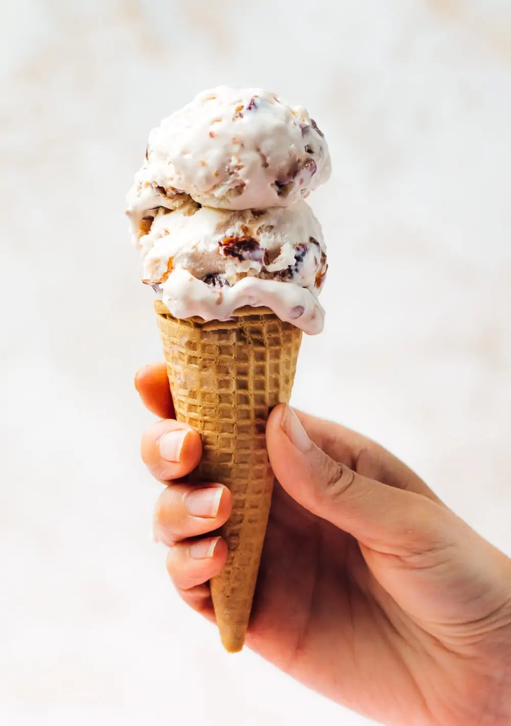 tart cherry ice cream in a cone