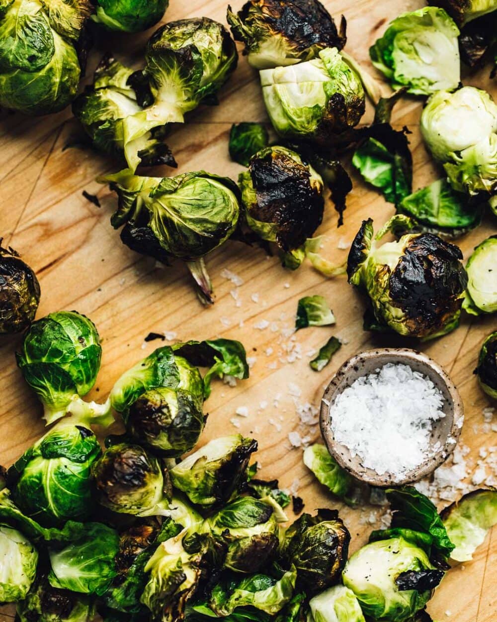 grilled brussels sprouts on a cutting board