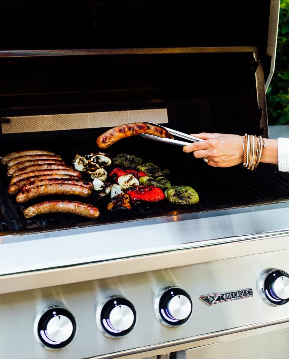 grilling brats with peppers and onions