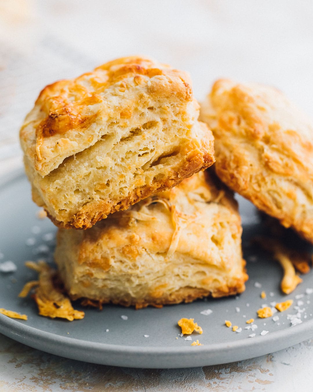 sourdough discard biscuits stacked on a blue plate