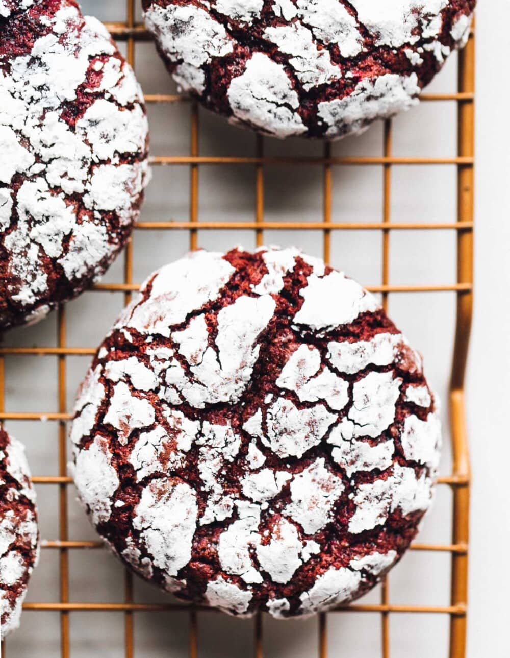 red velvet cookies on a copper wire rack