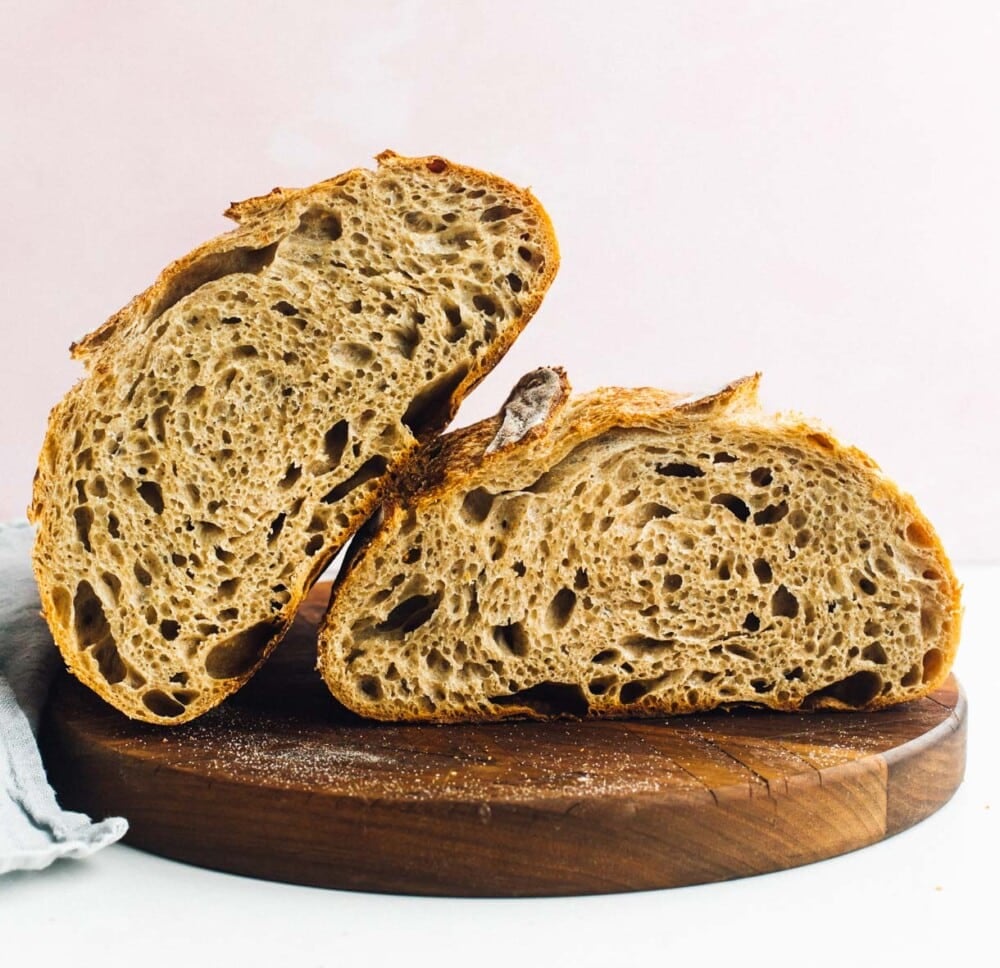 open crumb photo of spelt sourdough bread on a cutting board