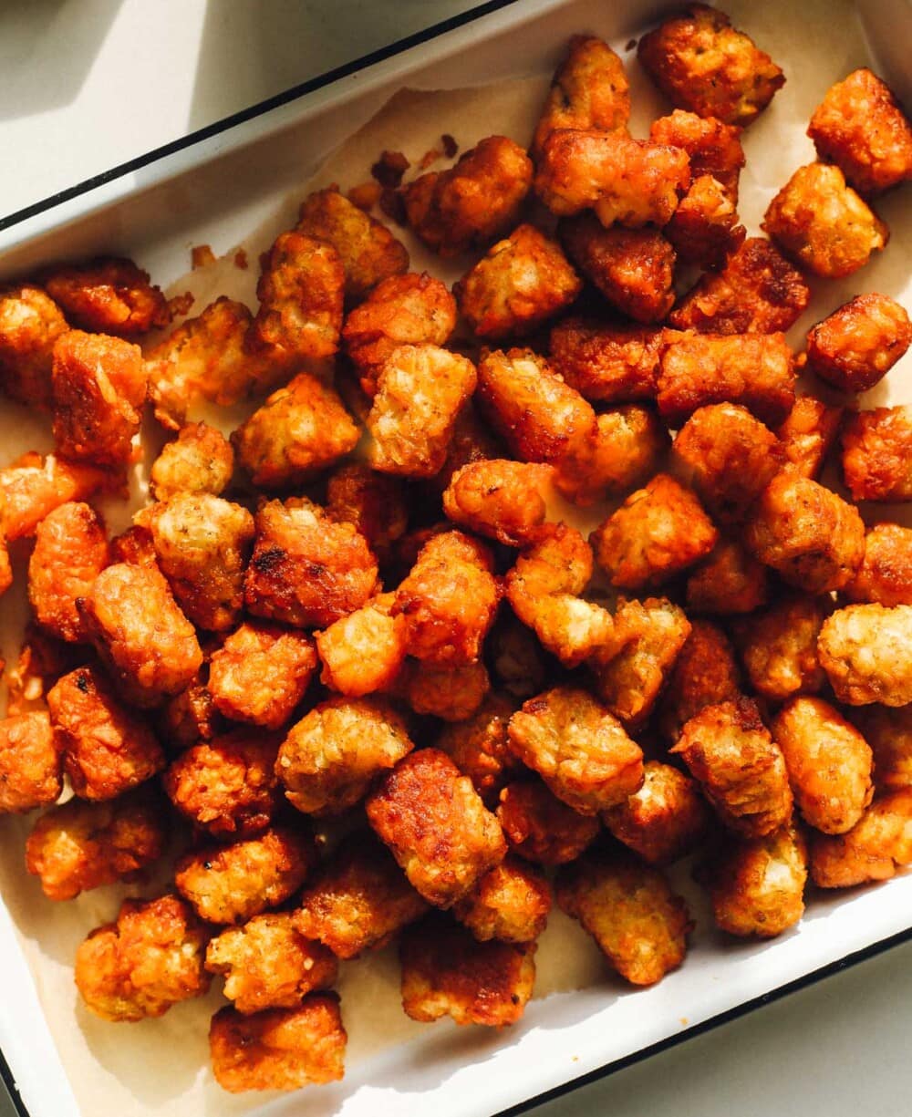 tater tots tossed in buffalo sauce