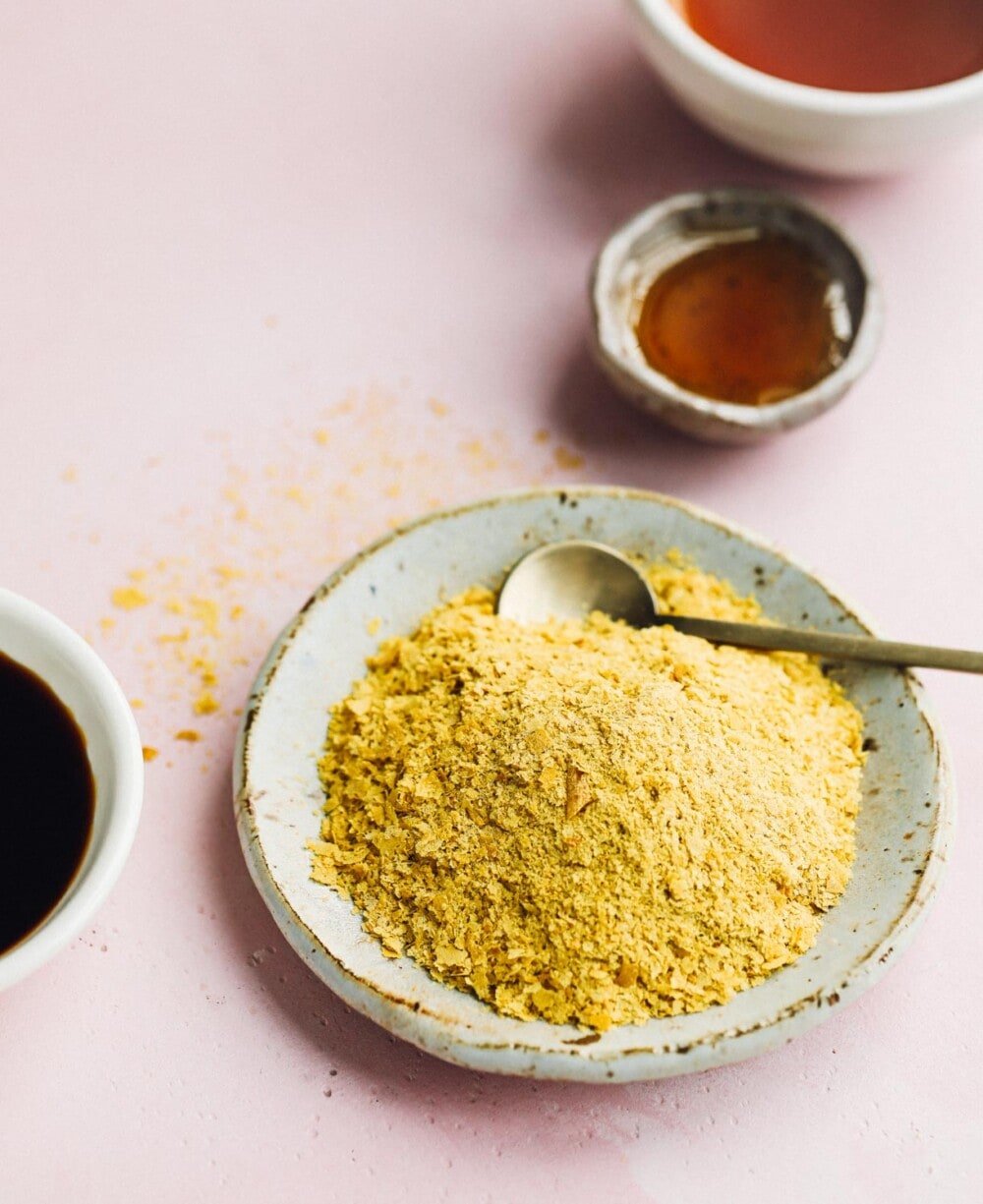 close up photo of nutritional photo in a low bowl with gold spoon