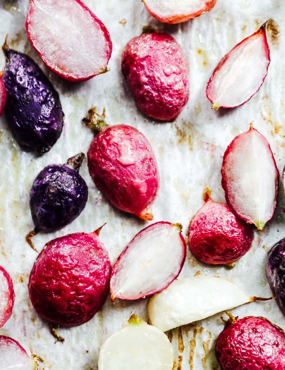 rainbow roasted radishes on parchment paper