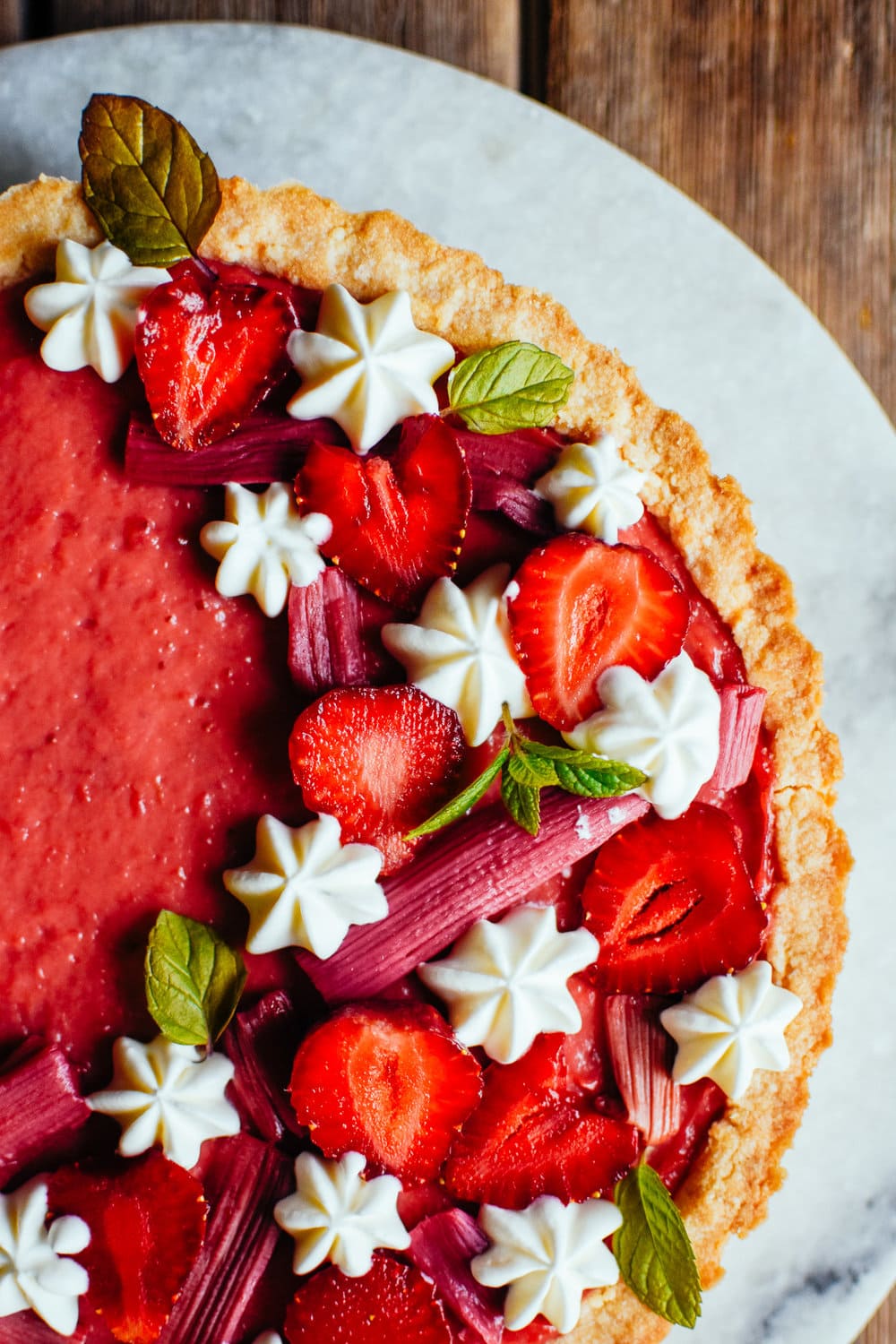 strawberry rhubarb tart with piped frosting