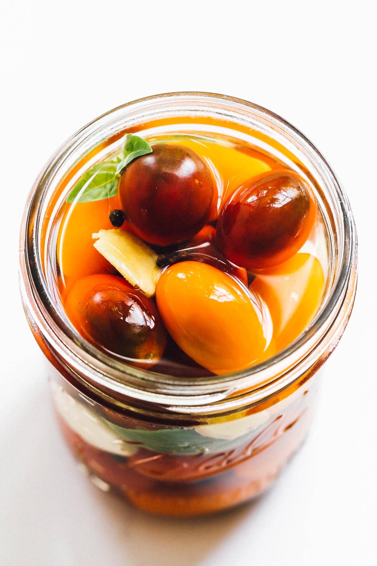 pickled cherry tomatoes in a glass jar