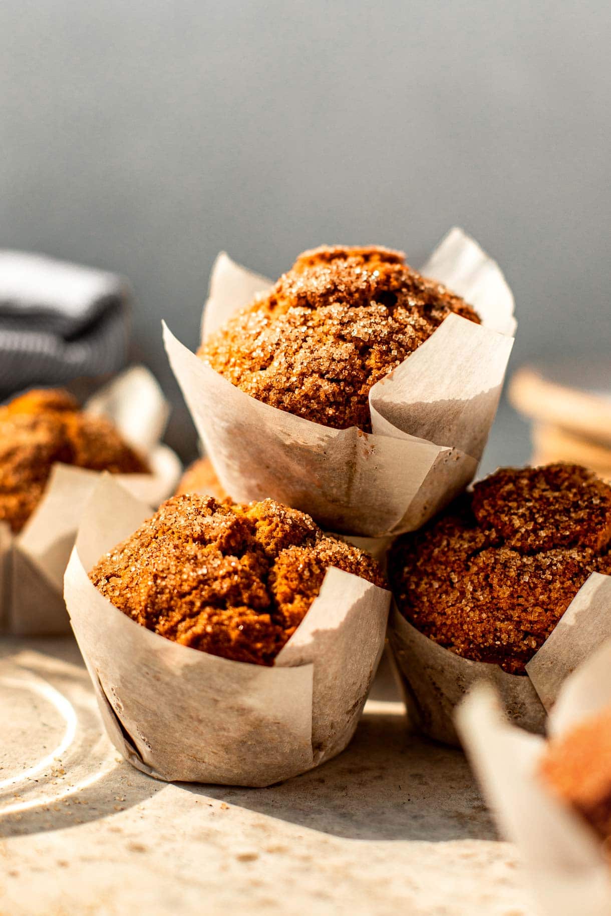 gluten-free pumpkin muffins stacked on one another