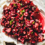 cranberry jalapeno cream cheese dip with a gold spoon