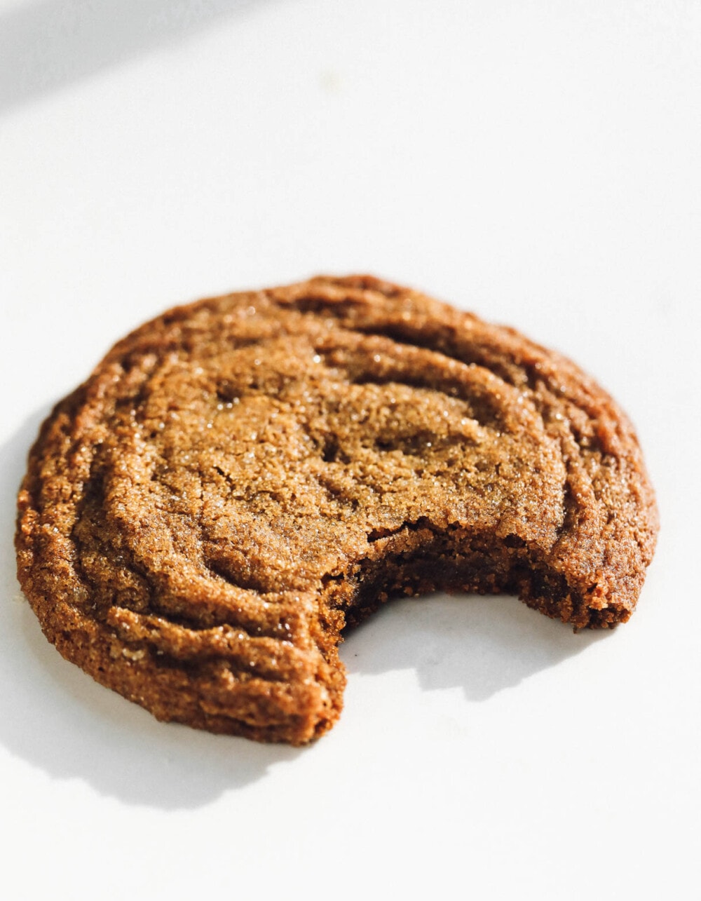 gluten-free ginger molasses cookies on white surface