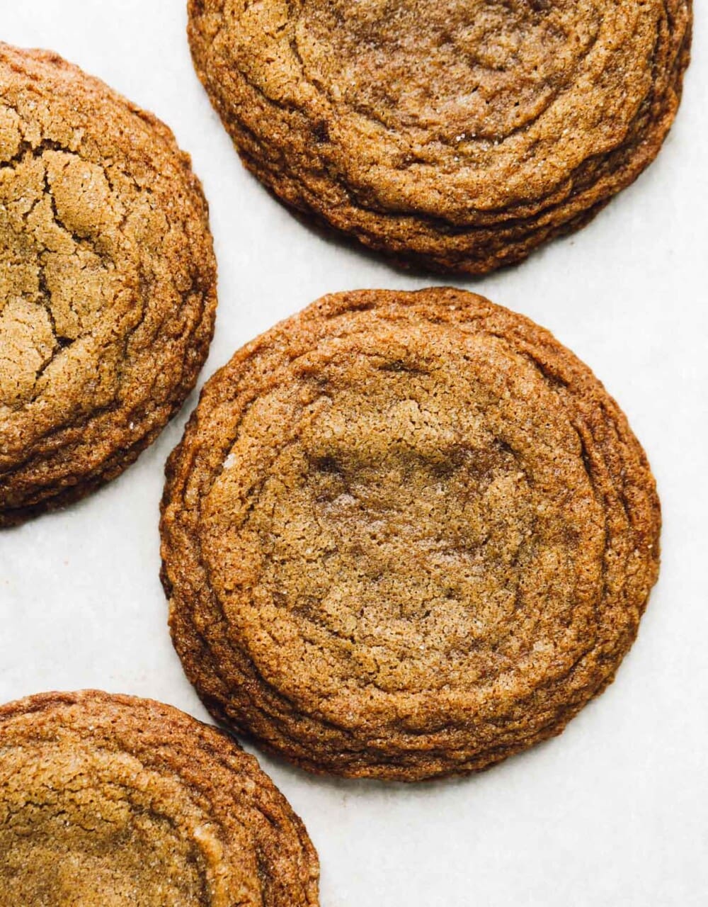 gluten-free ginger molasses cookies on white parchment paper