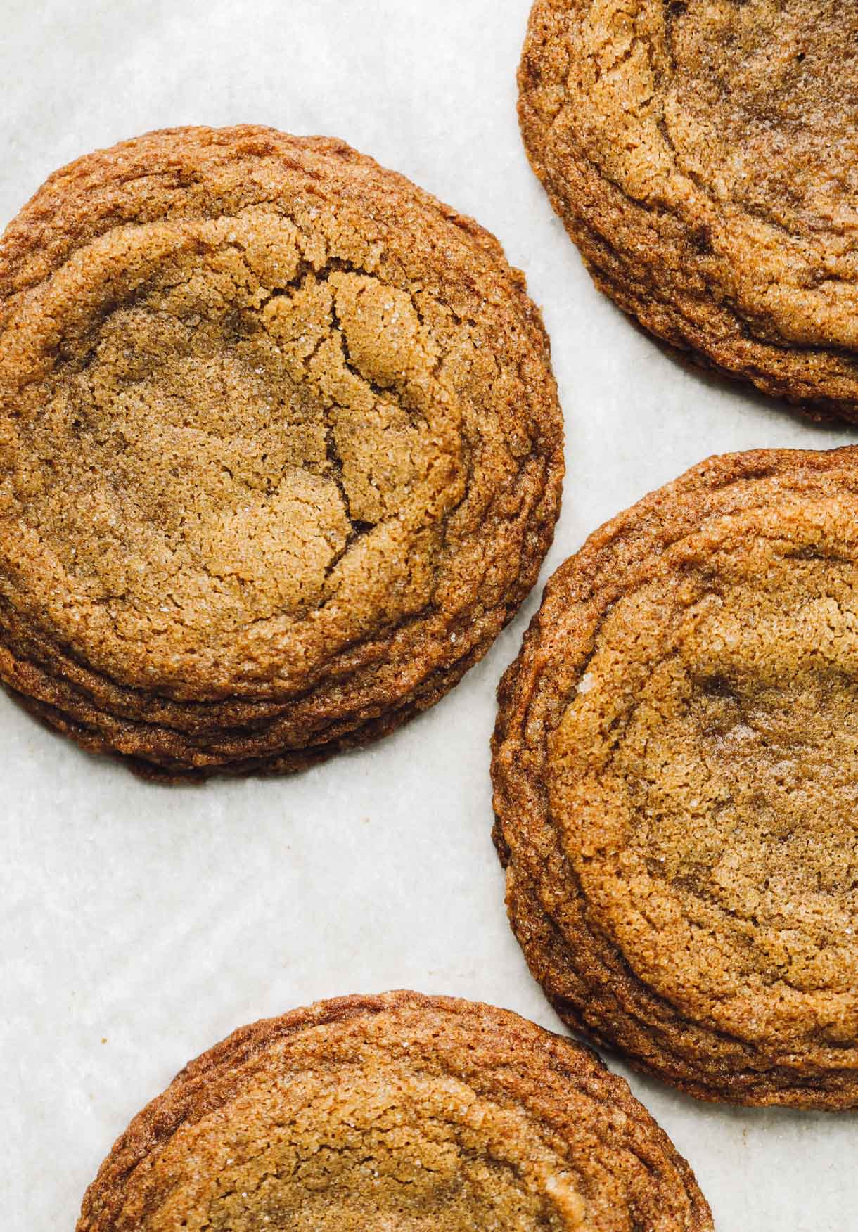 gluten-free ginger molasses cookies on white parchment paper